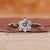 Solitaire engagement ring with a hexagon diamond design.
