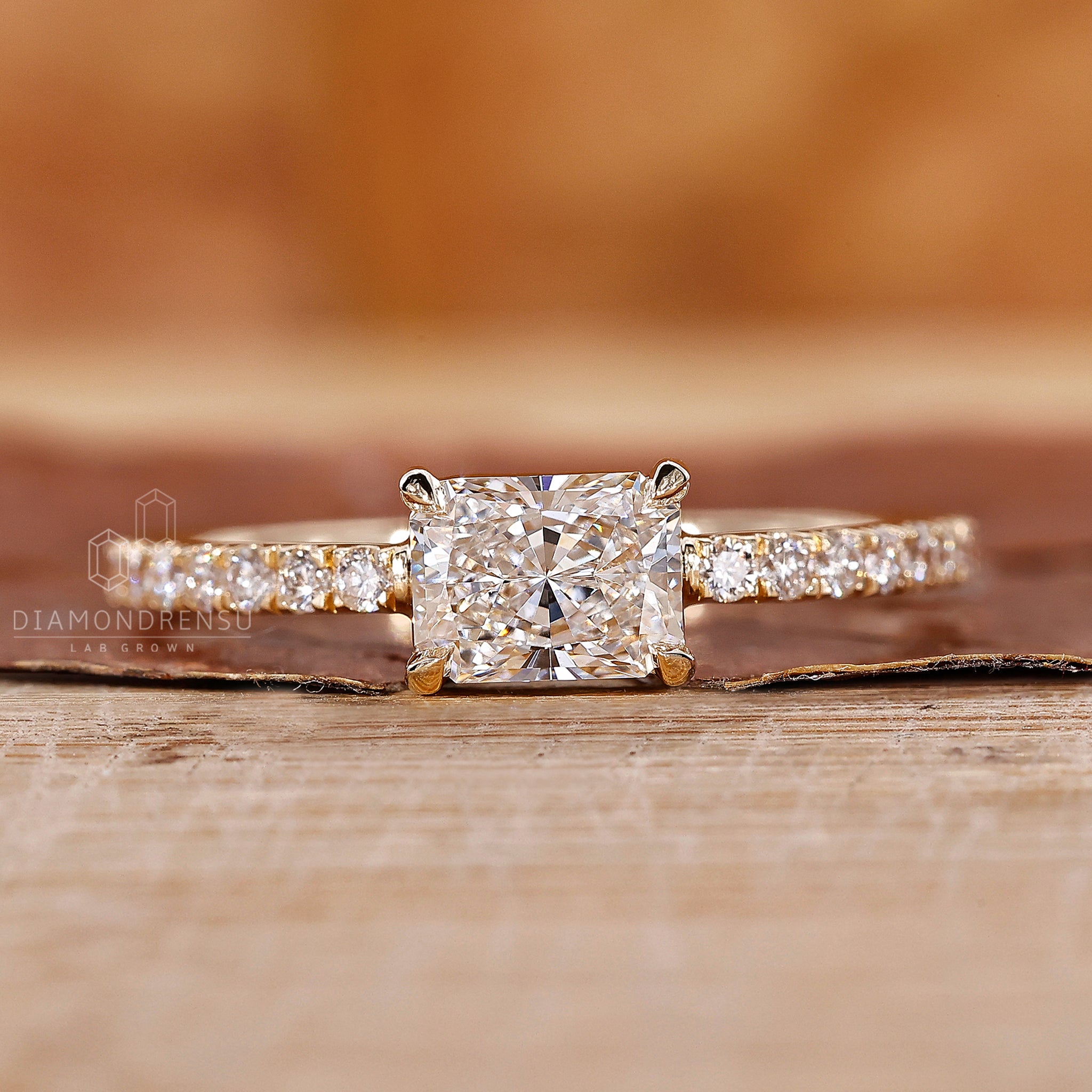 Diamondrensu UK engagement ring with lab diamond and four claw prong set.
