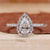 Pear cut diamond engagement ring with a sleek white gold band.
