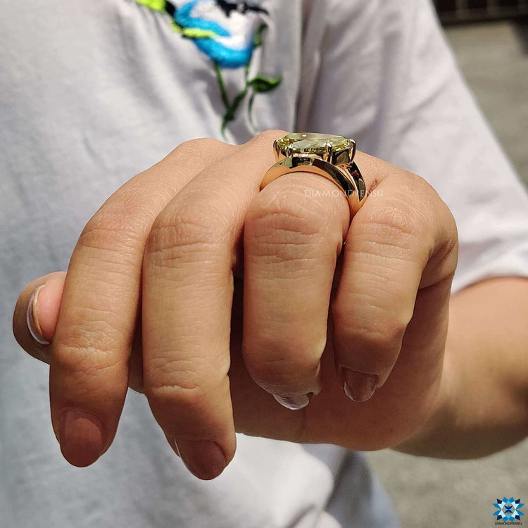 Prong set pear moissanite ring in gold.
