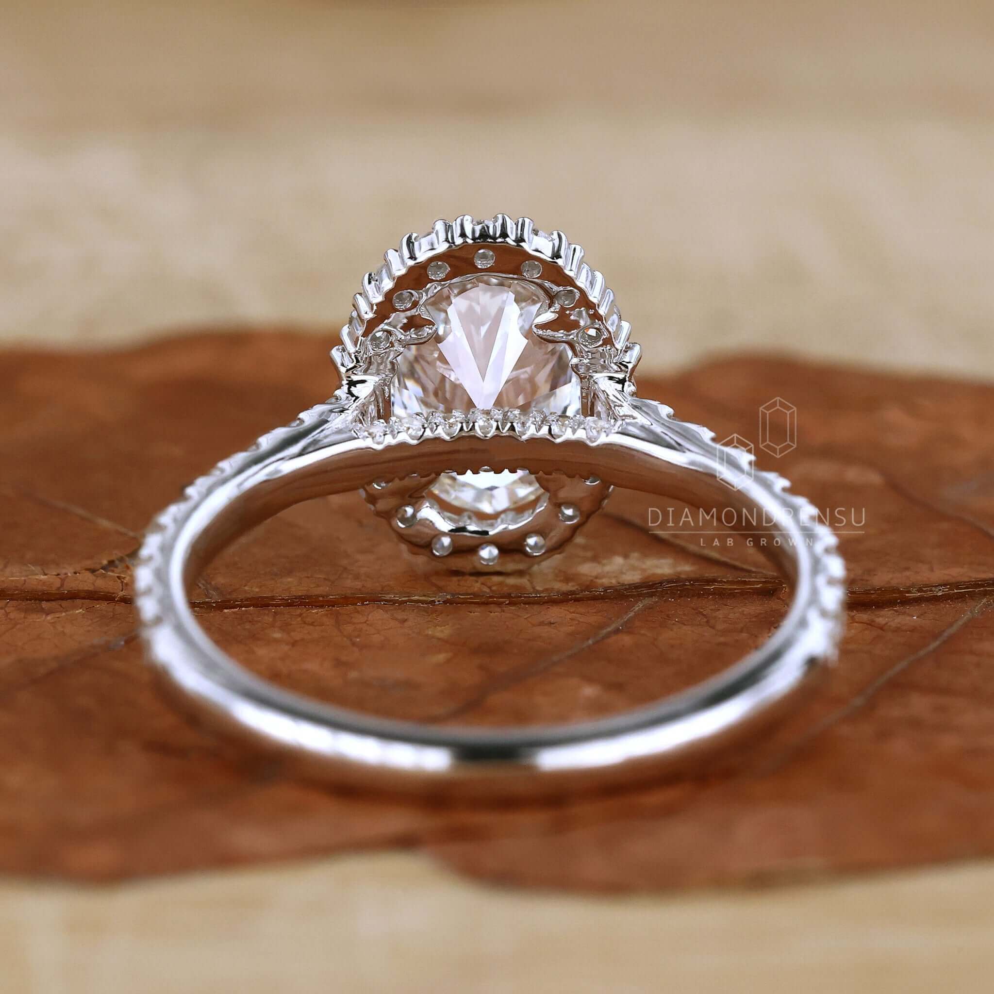 Oval halo diamond engagement ring designed to capture every cherished moment.