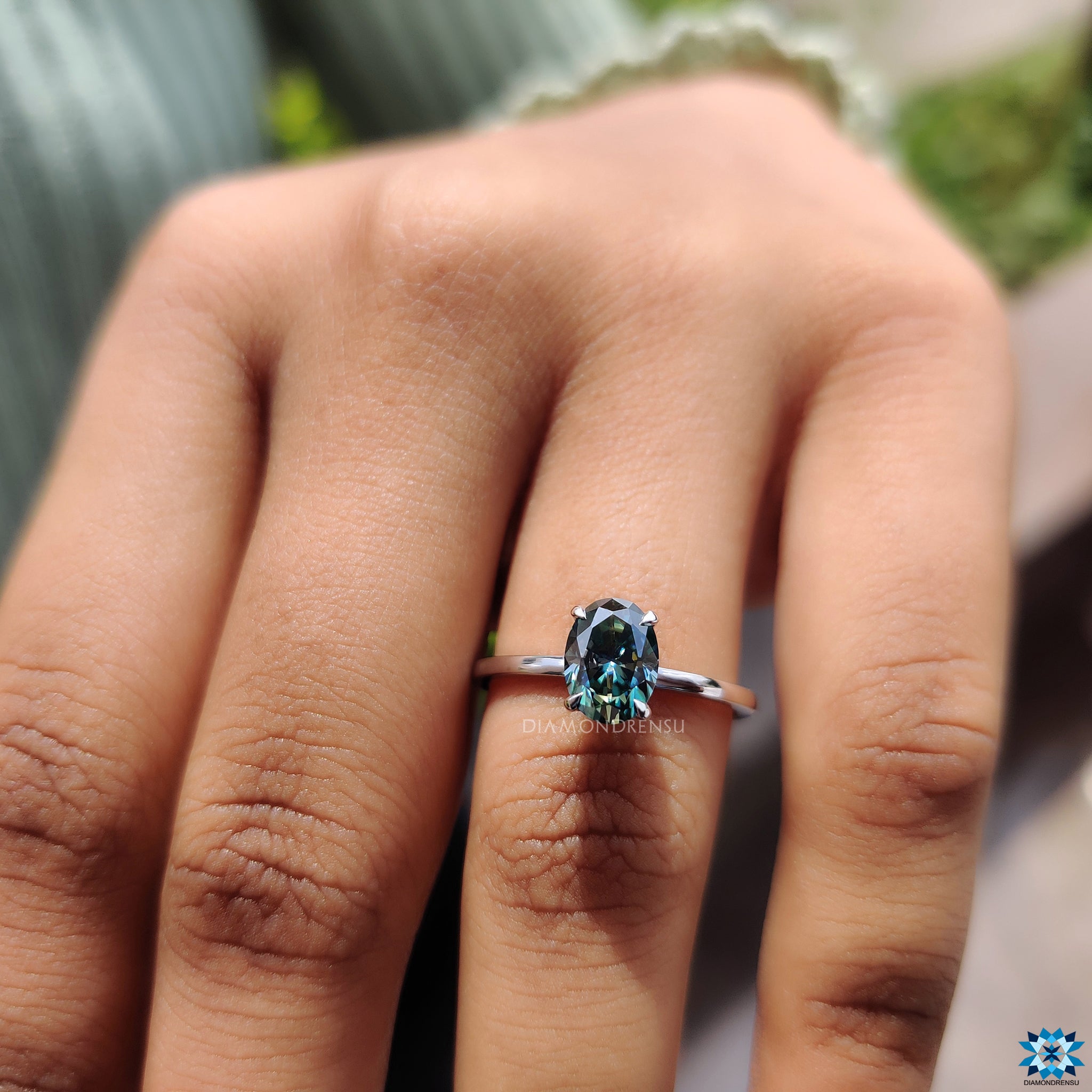 White gold ring in cyan blue moissanite ring style
