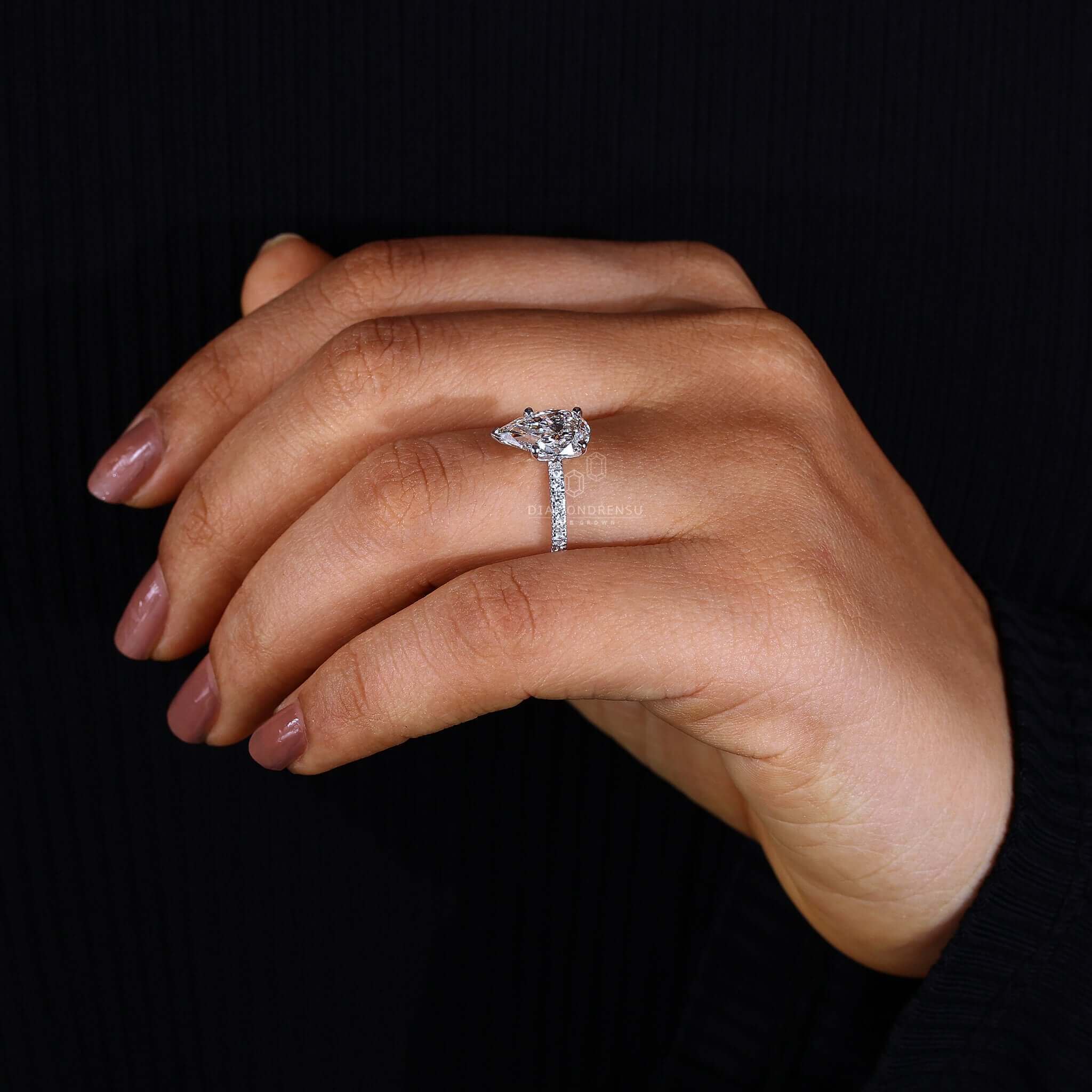 Stunning diamond pear cut ring with a pave setting for added brilliance.