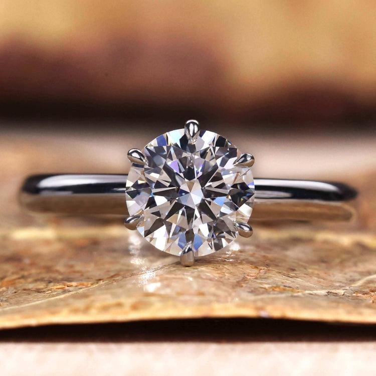 Gold Solitaire Engagement Ring featuring a stunning design for timeless elegance.