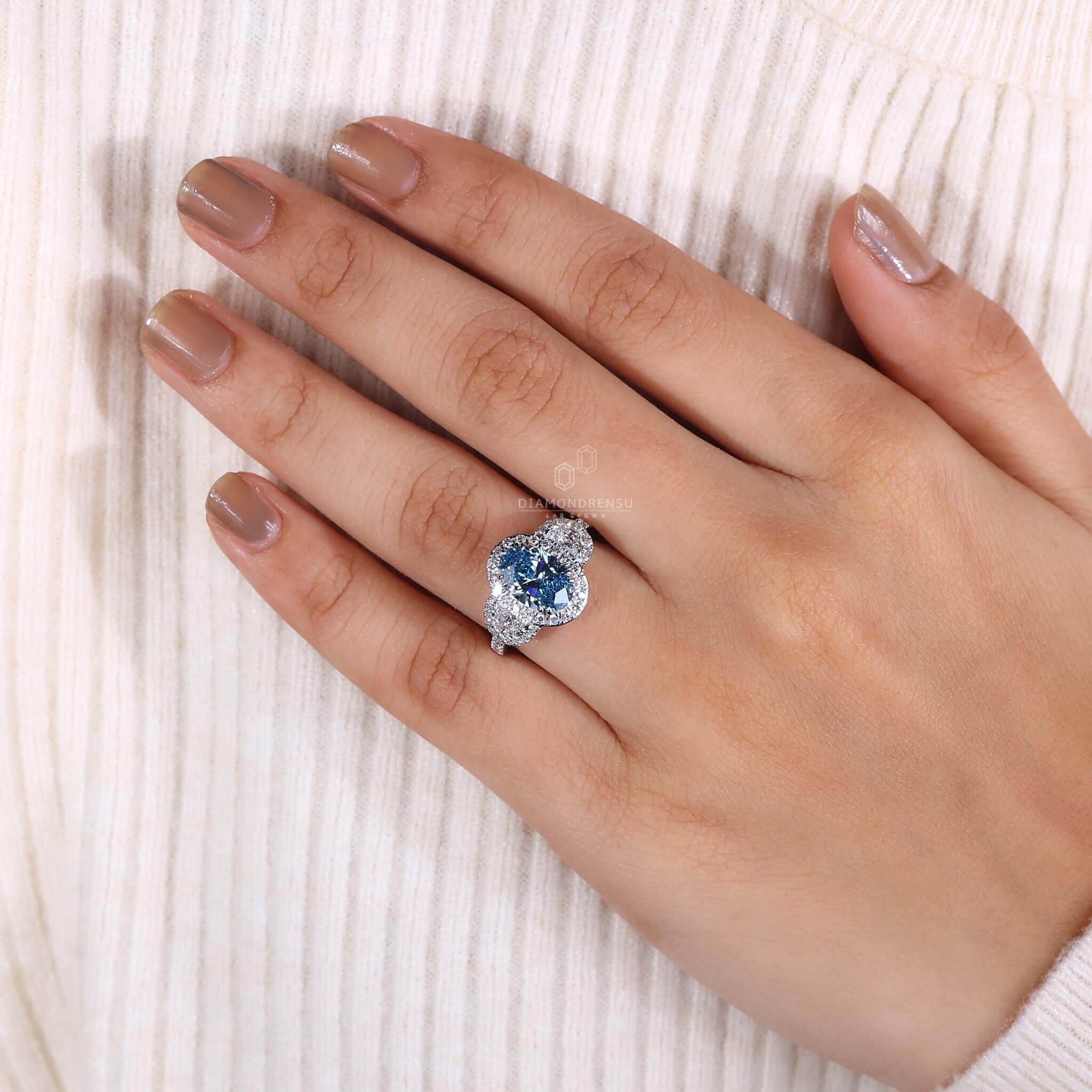 Blue Oval Diamond Ring featuring a striking blue diamond in an oval shape, perfect for special occasions.