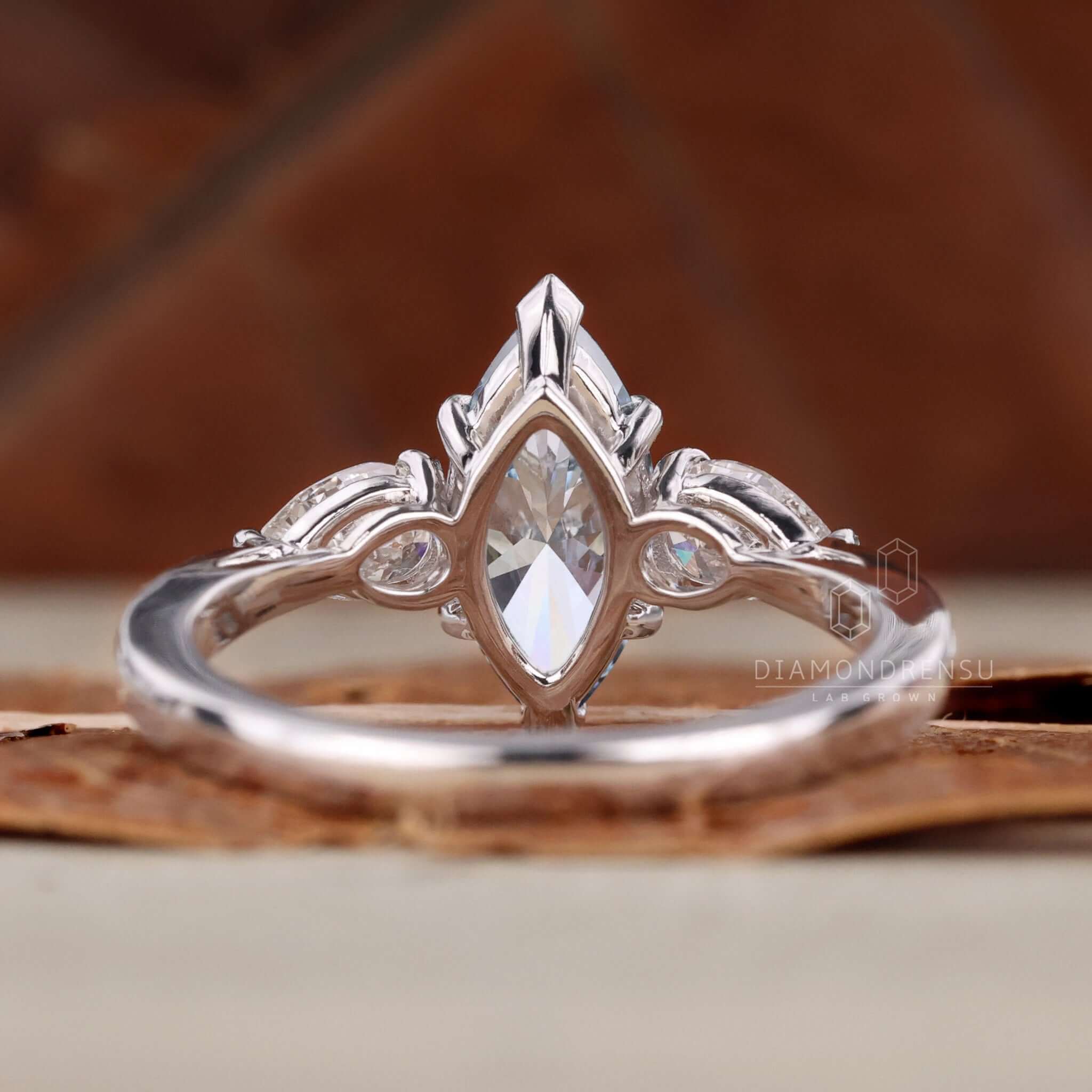 Handcrafted three stone ring with exquisite detailing and charm.