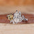 Dutch marquise diamond engagement ring with round side diamond and six claw prong set.
