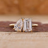 Toi et Moi engagement ring with emerald and pear cut diamonds