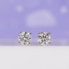 Yellow gold stud earrings featuring round cut lab grown diamonds.