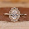 Oval Diamond Engagement Ring is made using a yellow gold ring and round diamond ring.
