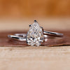 Pear shaped ring with a solitaire lab grown diamond.
