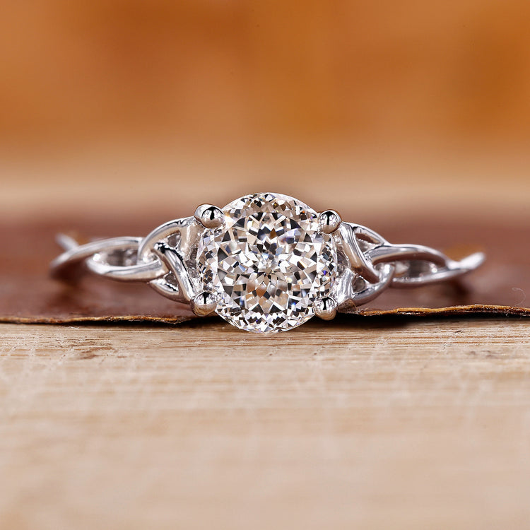 Portuguese cut diamond ring in a classic solitaire design.
