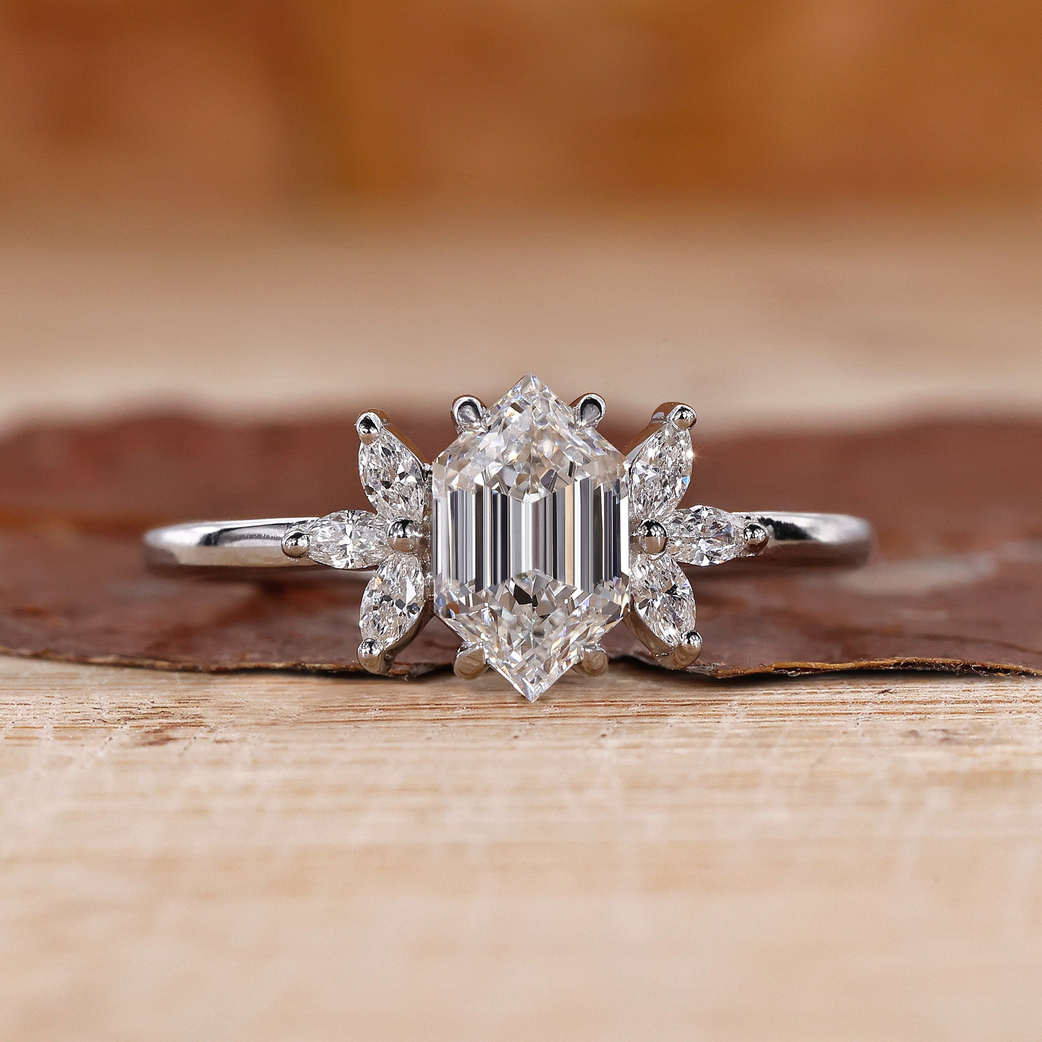 Hexagon engagement ring with marquise diamond side stones.
