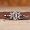 Hexagon engagement ring with marquise diamond side stones.
