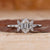 Hexagon engagement ring with marquise diamond side stones.

