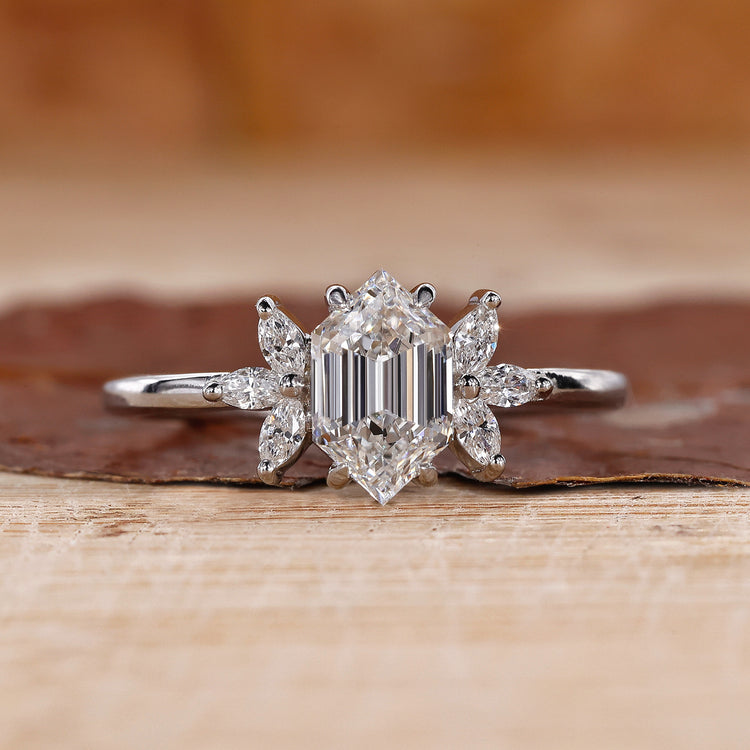 Hexagon engagement ring with marquise diamond side stones.
