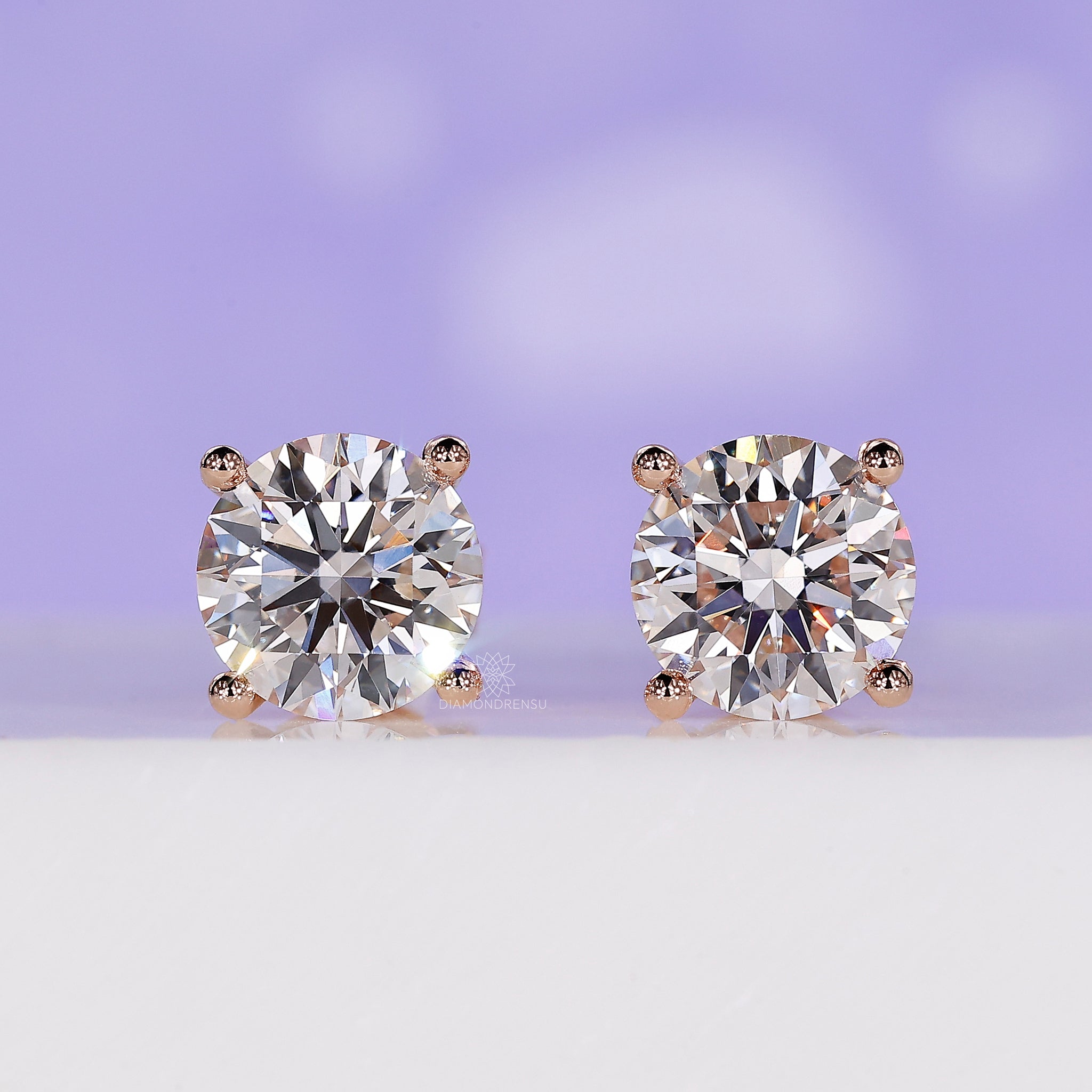 3 carat diamond stud earrings in rose gold.