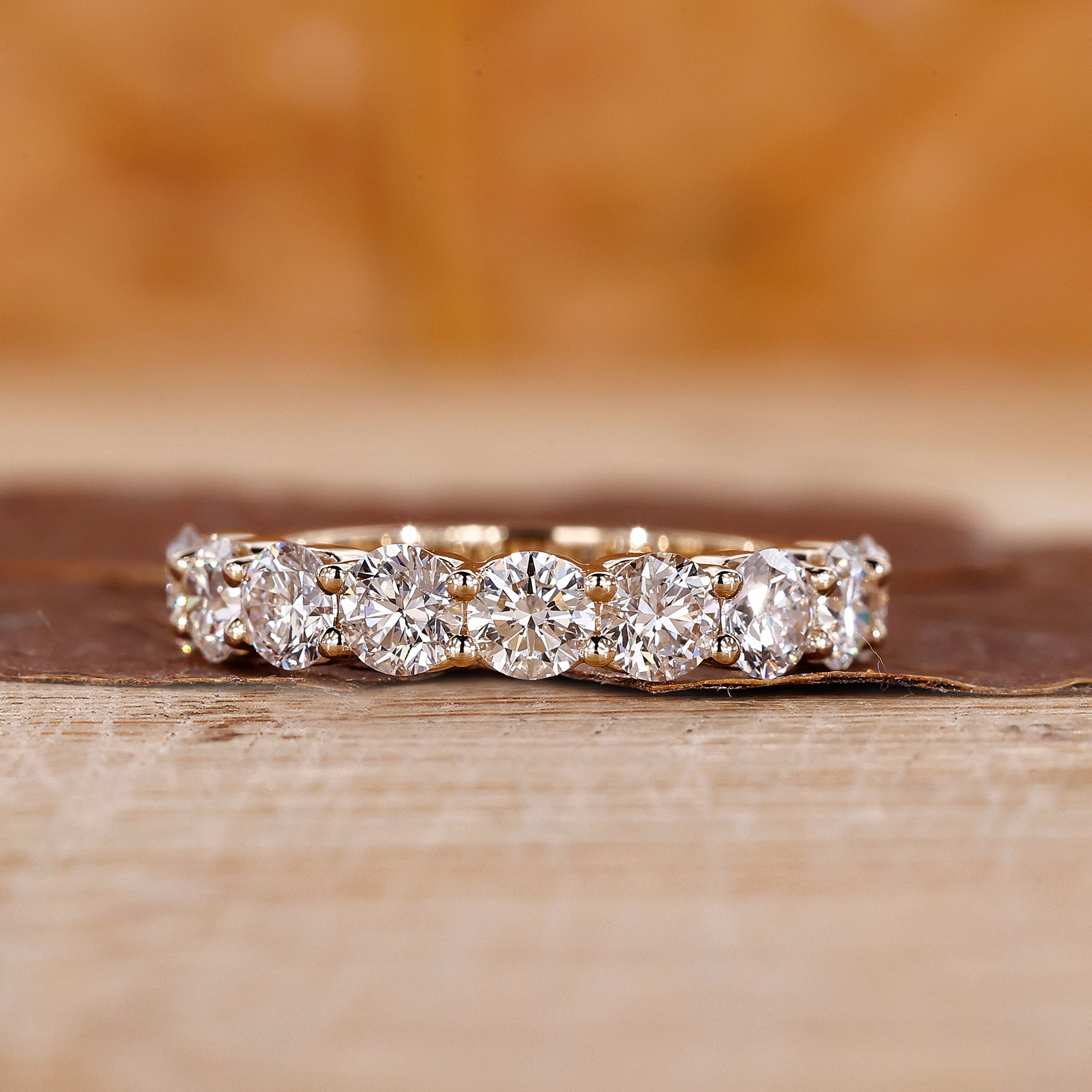 Round wedding band in prong setting
