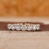 Round wedding band in prong setting
