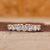 Round wedding band in prong setting
