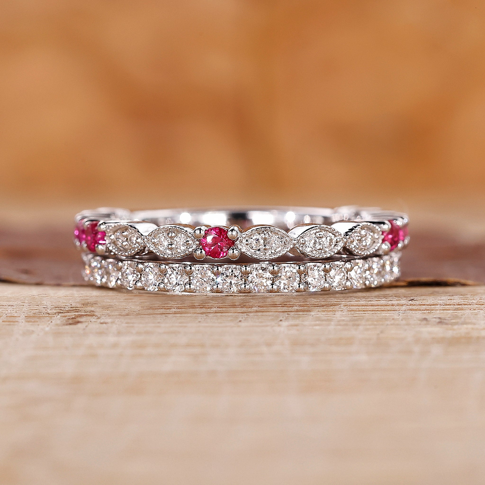 Ruby and diamond wedding band crafted with a double row pave design.
