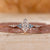 Dutch marquise diamond ring features cyan blue side stones.

