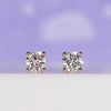 Diamond stud earrings for women crafted in rose gold with round diamonds.