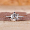 Hexagon engagement ring with hidden halo and pave setting.
