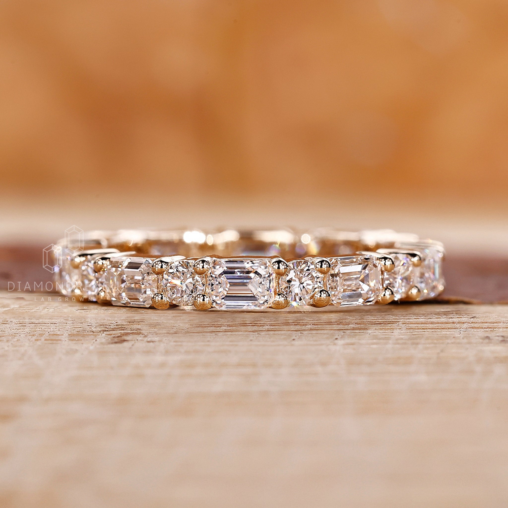 Yellow gold wedding band in prong setting
