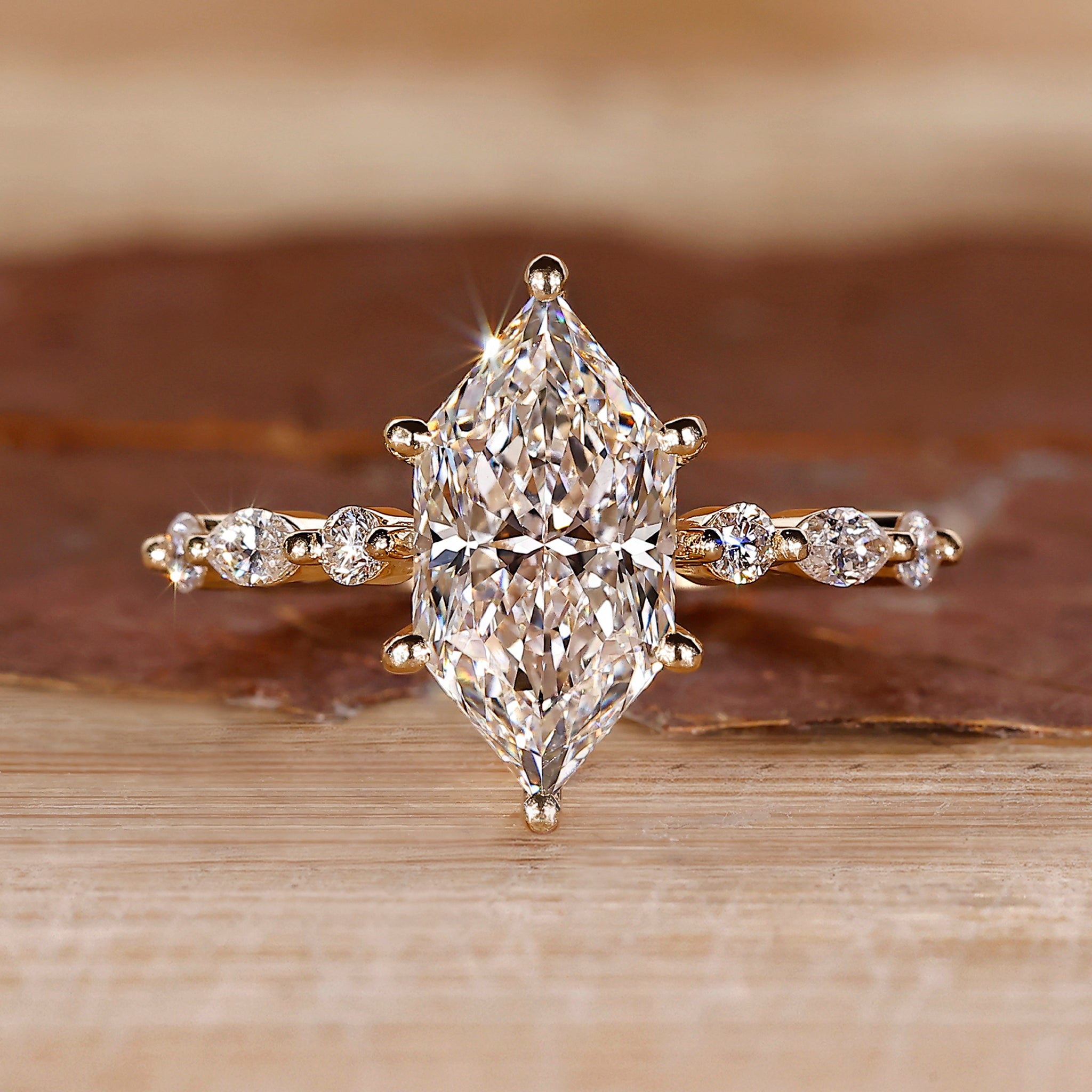 Dutch Marquise ring with shared prong pave band.
