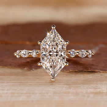 Dutch Marquise ring with shared prong pave band.

