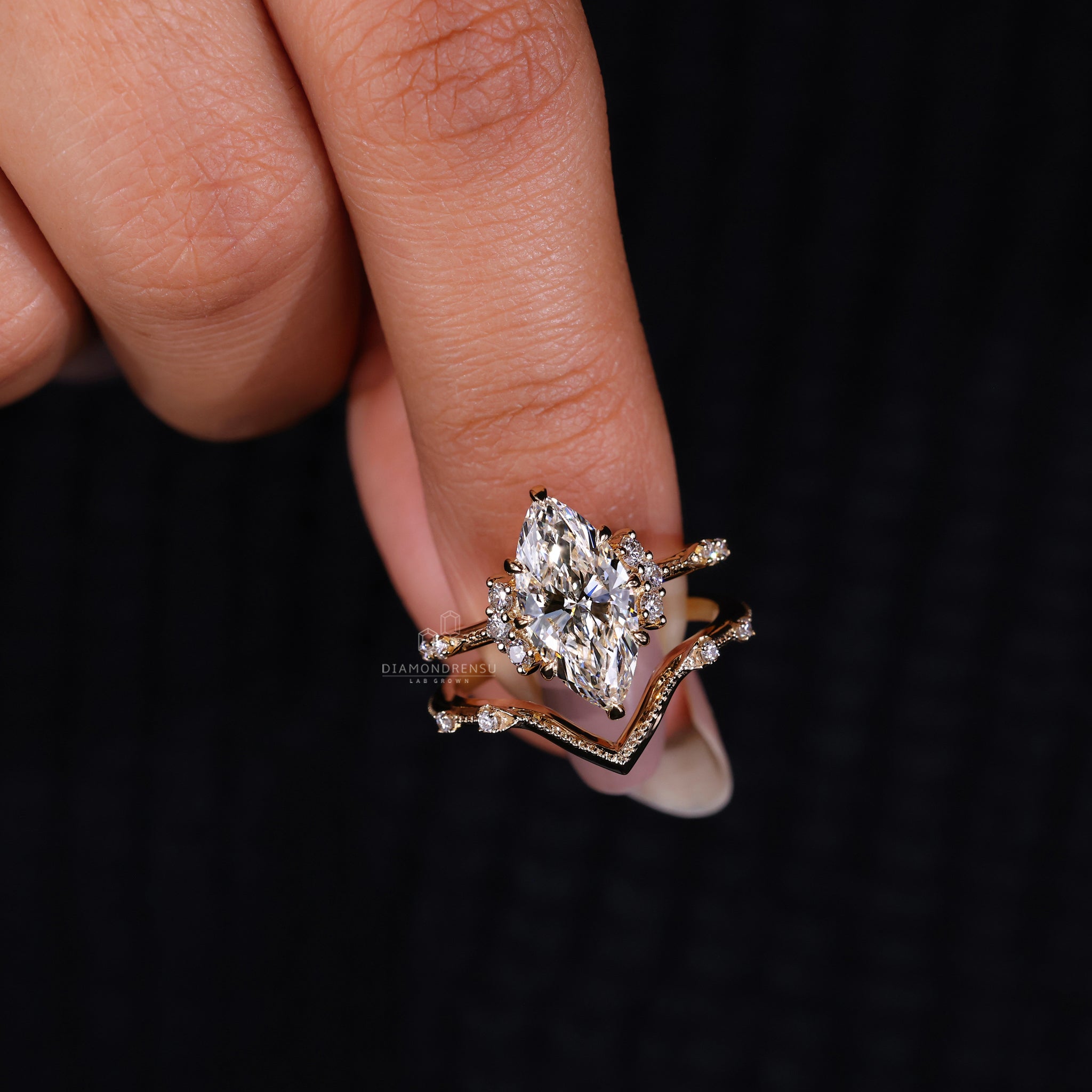 Stackable wedding band in claw prong ring design with vintage diamond ring.
