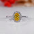 Oval cut diamond ring with a cathedral setting.
