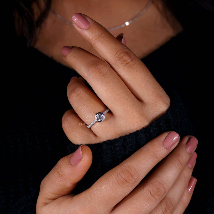 Engagement ring with bezel setting featuring a cathedral setting engagement ring design for a unique and modern appeal.
