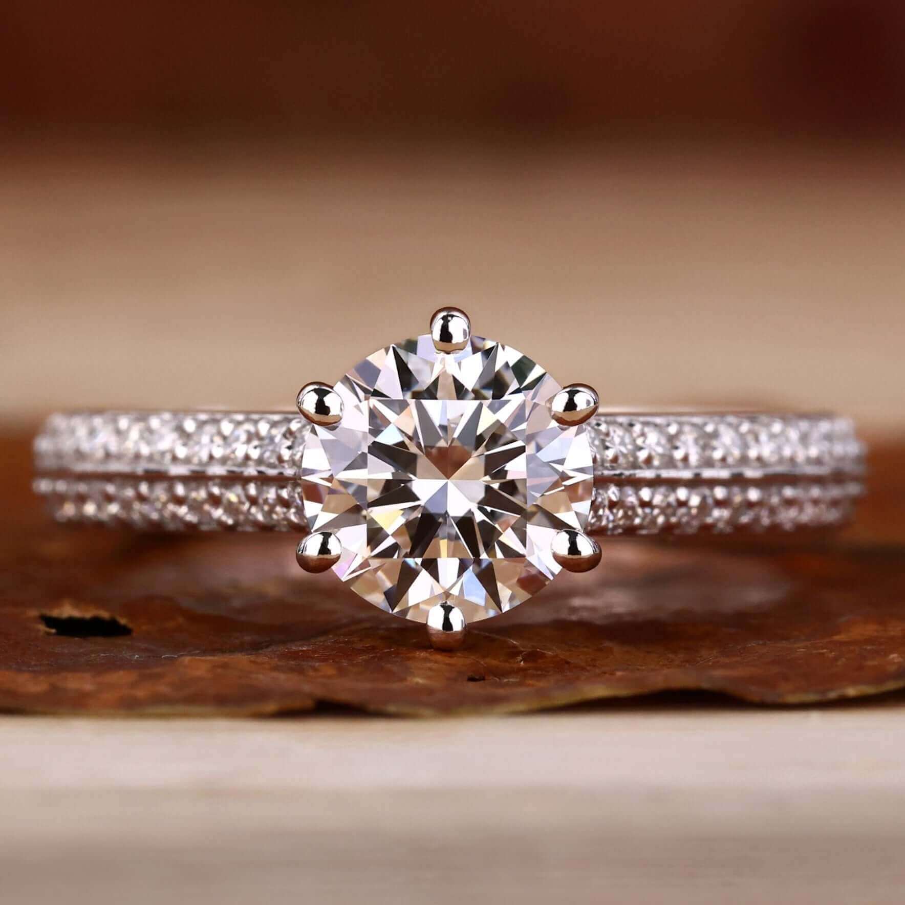 Cathedral setting ring with a round diamond and a knife edge engagement ring for timeless elegance in engagement rings.
