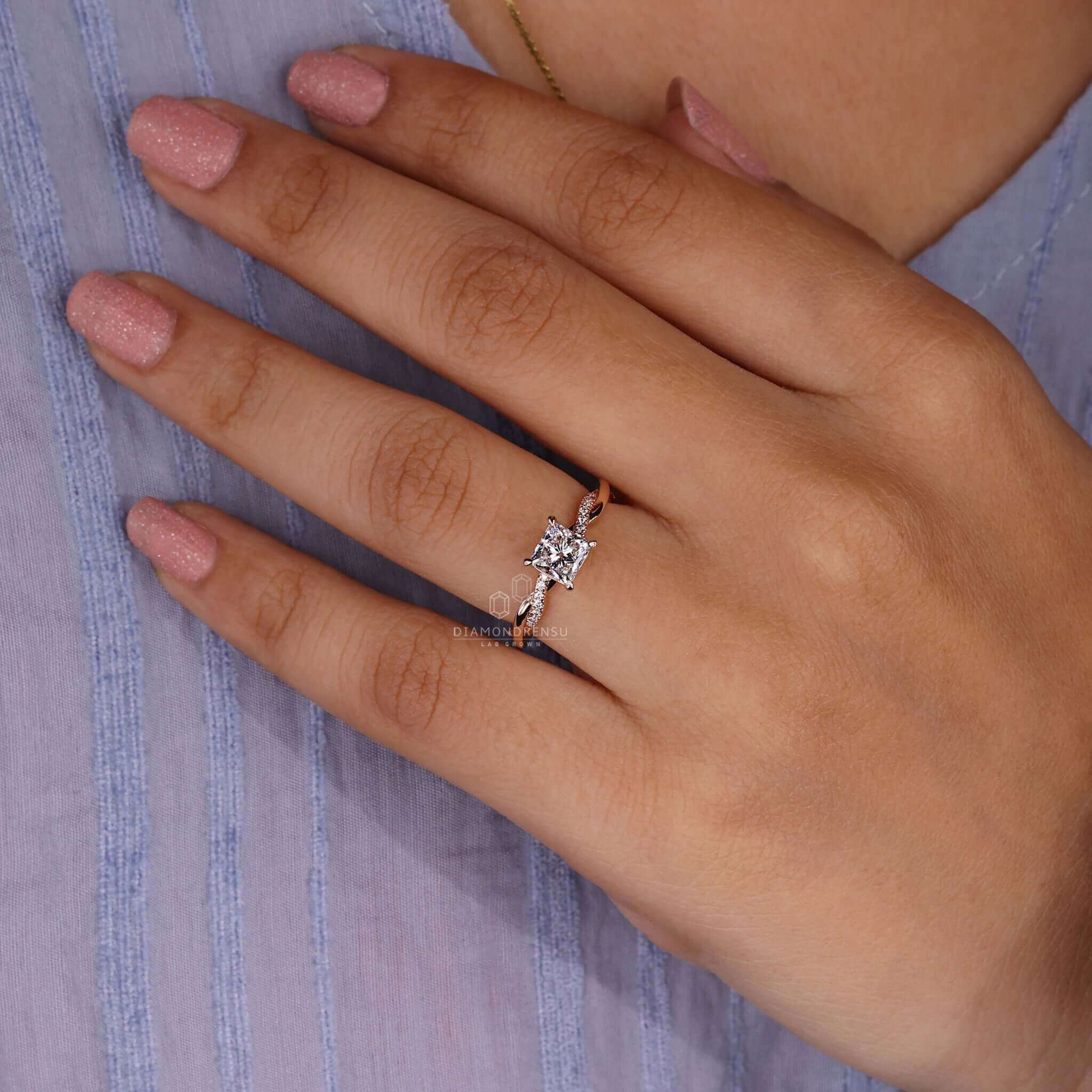 Rose gold diamond ring with a side stone engagement ring design perfect for special occasions.
