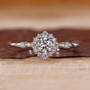 Diamond halo engagement ring with sparkling brilliance.
