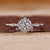 Diamond halo engagement ring with sparkling brilliance.
