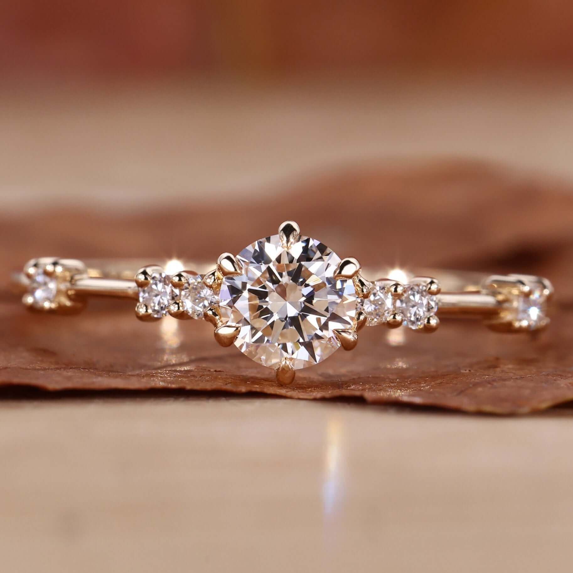 Round diamond ring featuring a brilliant lab-grown diamond in a distance pave setting.