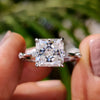 White gold moissanite ring with radiant Rensu cut and distance pave.
