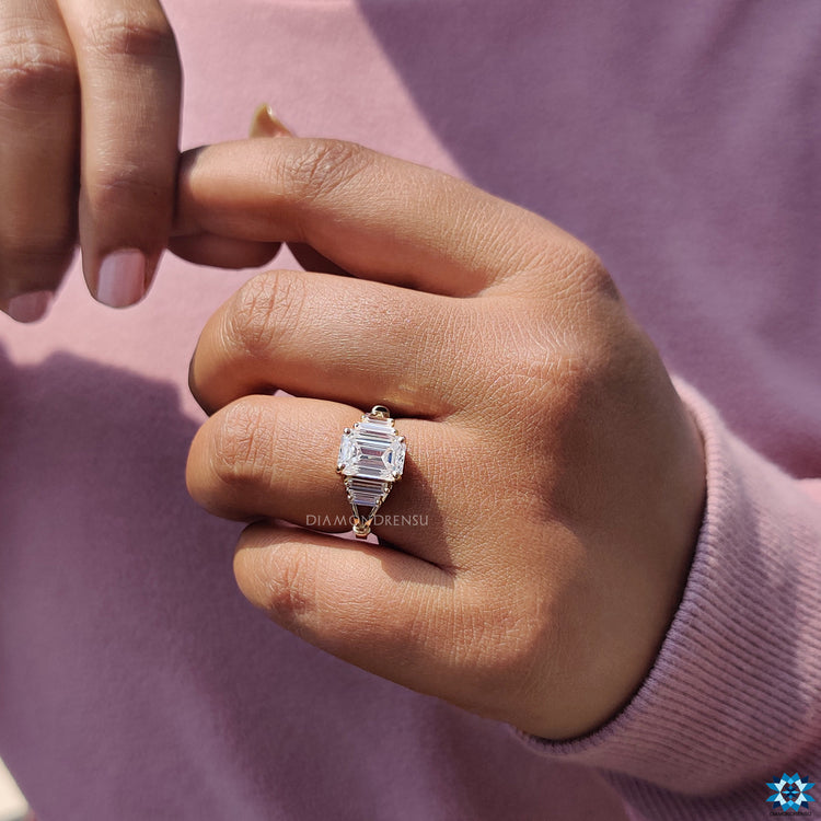 Diamondrensu UK yellow gold emerald cut moissanite ring.
