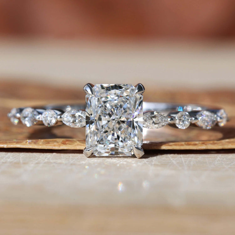 Radiant cut diamond ring with a stunning 4 prong claw setting for timeless elegance and style.

