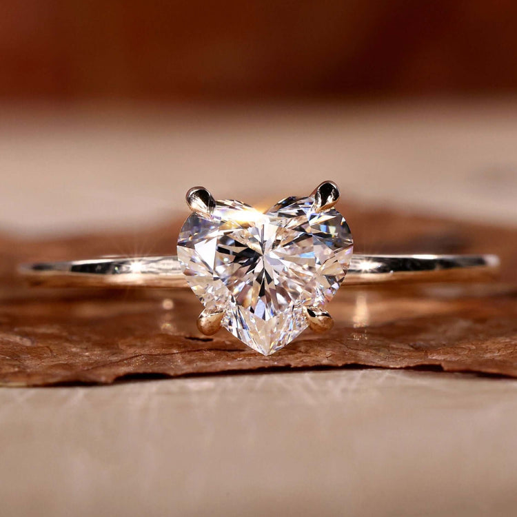 Heart shaped diamond ring with a stunning claw prong engagement ring setting for timeless elegance.