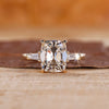 Cushion old mine cut ring with tapered baguette sides.
