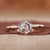 Solitaire diamond ring with tapered ring shank in yellow gold.
