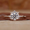 Round halo engagement ring in yellow gold.

