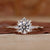 Round halo engagement ring in yellow gold.
