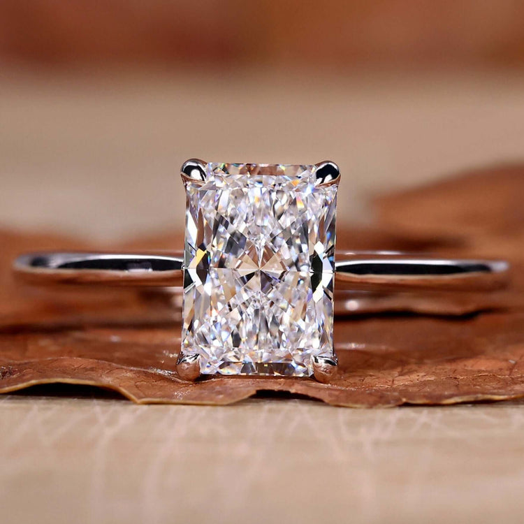 Solitaire diamond ring with a classic design in radiant brilliance.