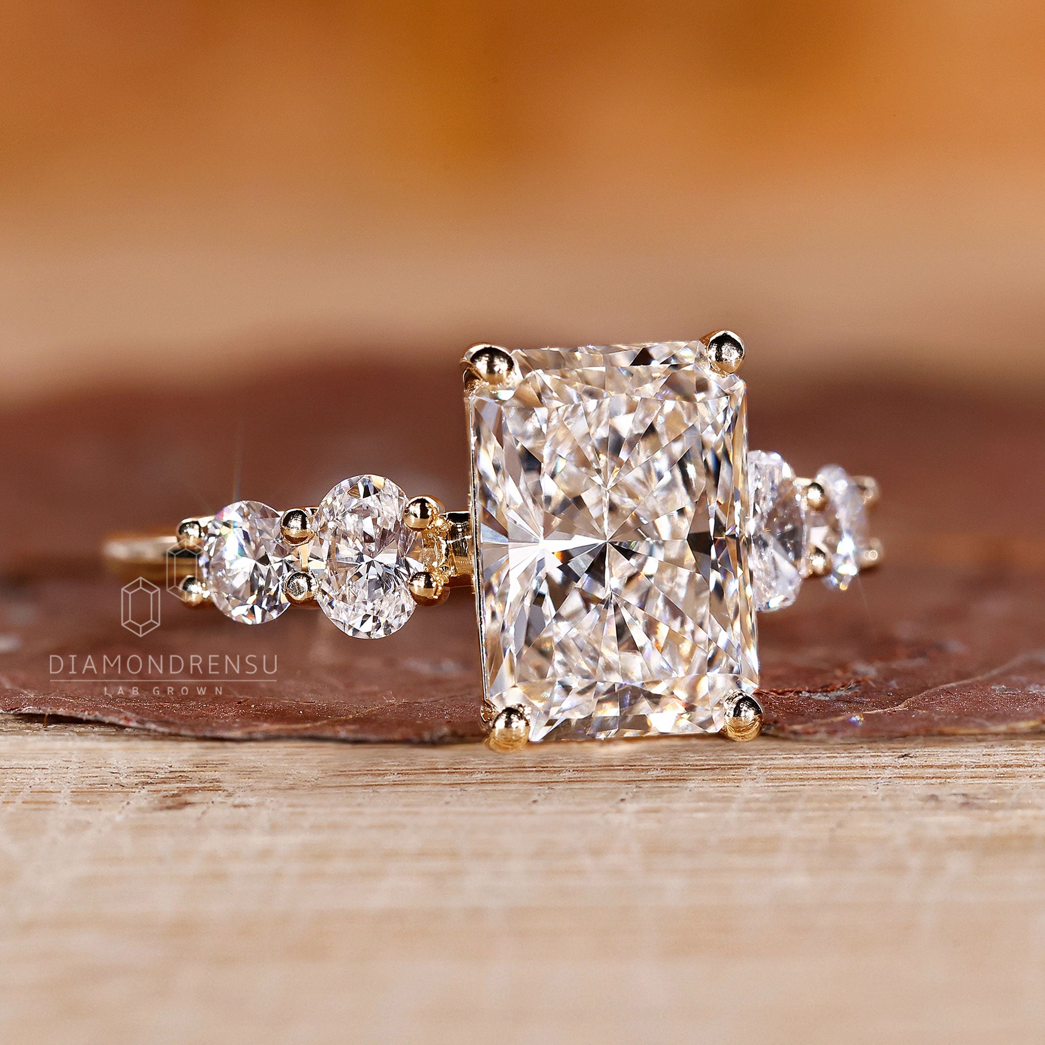 Yellow gold ring adds warmth to the radiant setting.
