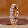 Heart shaped diamond wedding band in rose gold.

